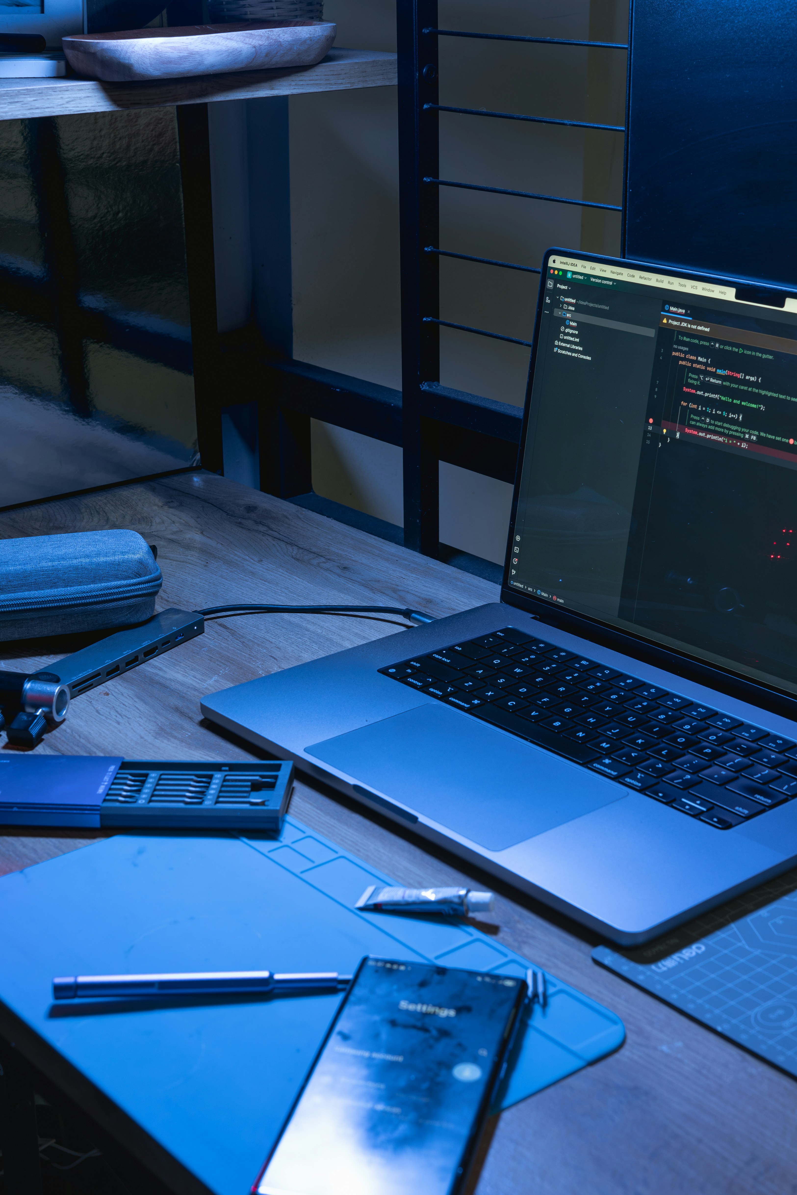 Laptop and smartphone in a modern software development workspace